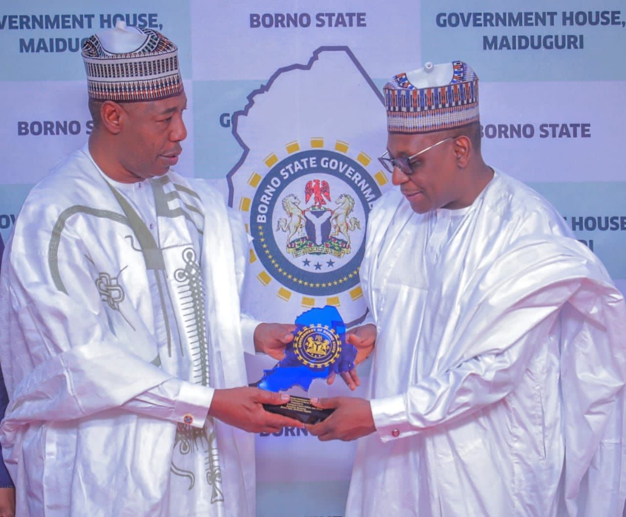 Governor Babagana Umara Zulum presenting a souvenir to Nigeria’s minister of health, Professor Mohammed Ali Pate during the minister’s visit to Government House, Maiduguri on Friday.