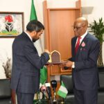 UAE Ambassador to Nigeria, HE Salem Saeed Al Shamsi presenting a gift to the FCT Minister, Barrister Nyesom Wike during the envoy's visit to the Minister, on Monday