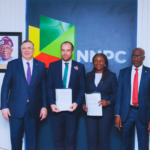 R-L: Executive Vice President, Upstream, NNPC Ltd., Oritsemeyiwa Eyesan and Managing Director and Country Chair, TotalEnergies EP Nigeria, Matthieu Bouyer, sign an MoU between NNPC Ltd. and TotalEnergies on the use of the latter’s Airborne Ultralight Spectrometer for Environment Detection (AUSEA) Technology, aimed at detecting and monitoring methane emissions in oil and gas operations. Watching with keen interest are the Group Chief Executive Officer of NNPC Ltd., Mele Kyari (standing right) and Chairman and Chief Executive Officer of TotalEnergies, Patrick Pouyanné (standing left).